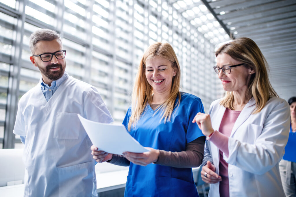 Group of doctors walking in corridor on medical conference